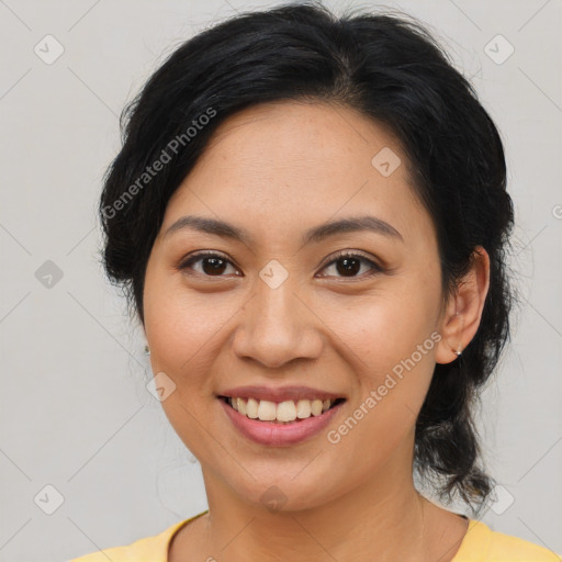 Joyful latino young-adult female with medium  brown hair and brown eyes