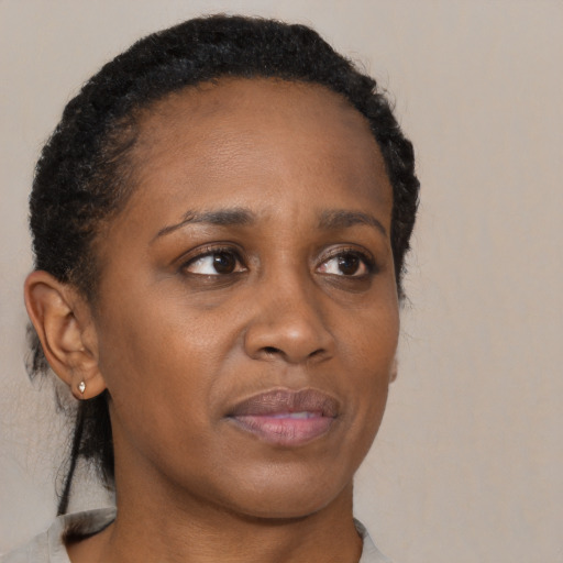 Neutral black young-adult female with short  brown hair and brown eyes