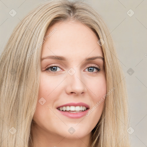 Joyful white young-adult female with long  brown hair and blue eyes