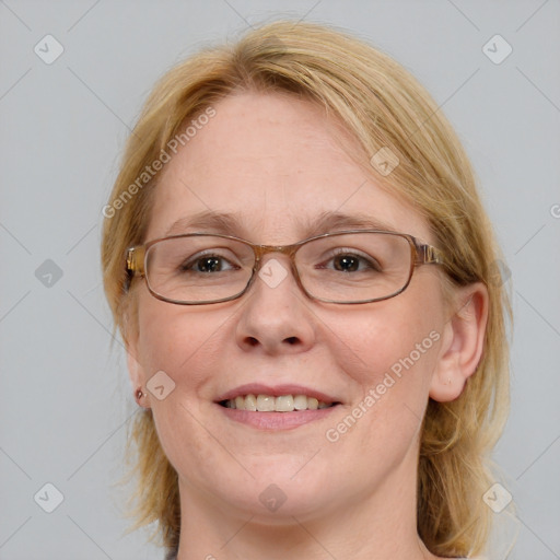 Joyful white adult female with medium  brown hair and blue eyes