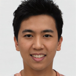 Joyful asian young-adult male with short  black hair and brown eyes