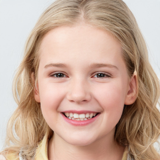 Joyful white child female with long  brown hair and brown eyes