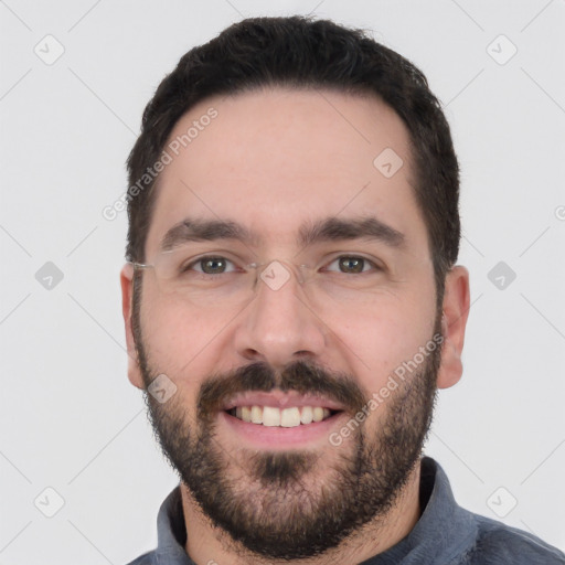 Joyful white young-adult male with short  black hair and brown eyes