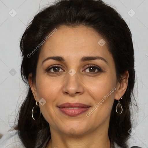 Joyful white adult female with medium  brown hair and brown eyes