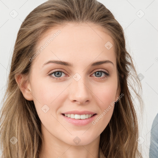 Joyful white young-adult female with long  brown hair and blue eyes