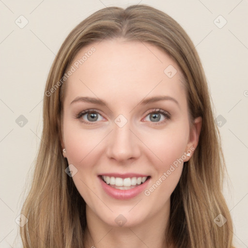 Joyful white young-adult female with long  brown hair and blue eyes