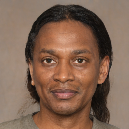 Joyful asian adult male with medium  black hair and brown eyes