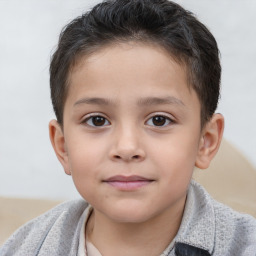 Joyful white child male with short  brown hair and brown eyes