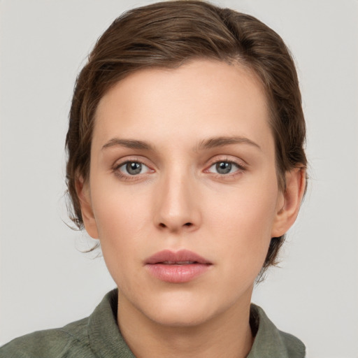 Neutral white young-adult female with medium  brown hair and grey eyes