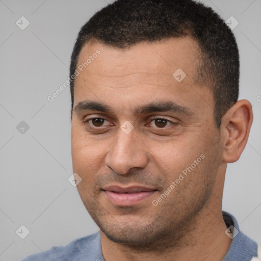 Joyful white young-adult male with short  black hair and brown eyes