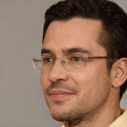 Joyful white adult male with short  brown hair and brown eyes