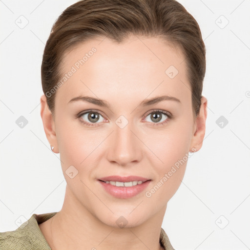 Joyful white young-adult female with short  brown hair and grey eyes