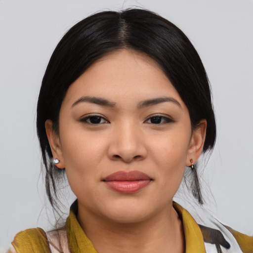Joyful asian young-adult female with medium  black hair and brown eyes