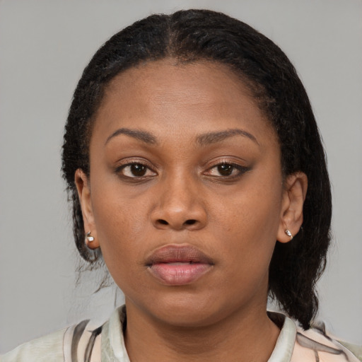 Neutral black young-adult female with short  brown hair and brown eyes