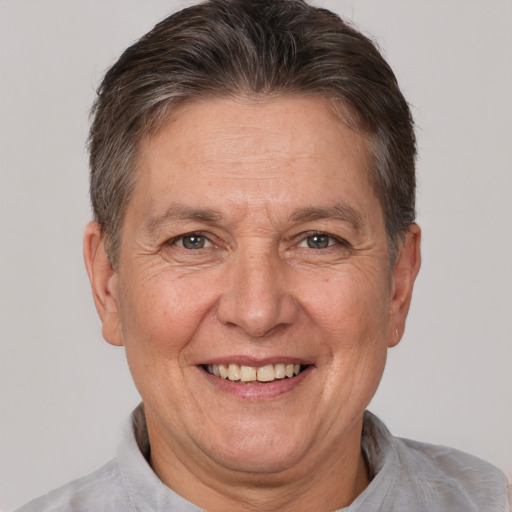 Joyful white middle-aged male with short  brown hair and brown eyes