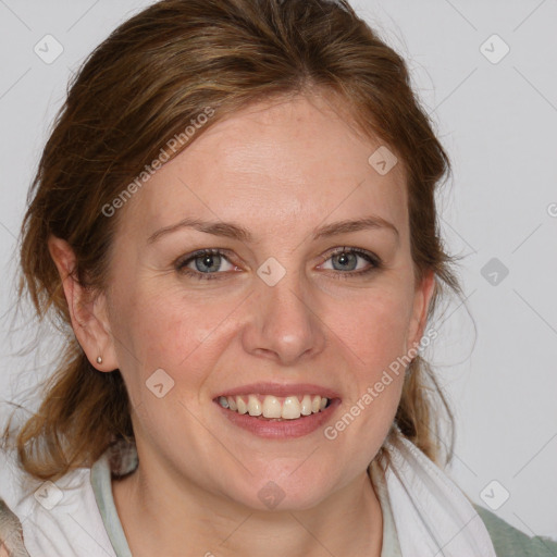 Joyful white young-adult female with medium  brown hair and blue eyes