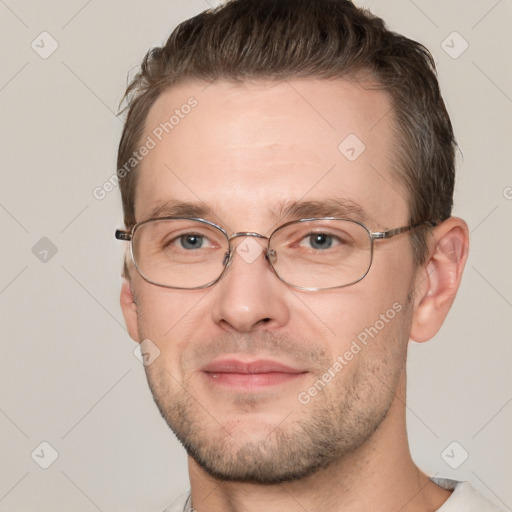 Joyful white adult male with short  brown hair and grey eyes