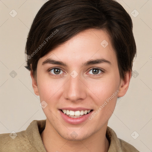 Joyful white young-adult female with short  brown hair and brown eyes