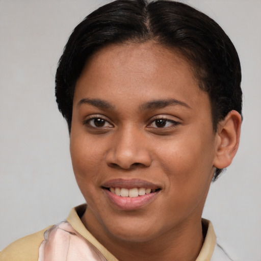 Joyful latino young-adult female with short  brown hair and brown eyes