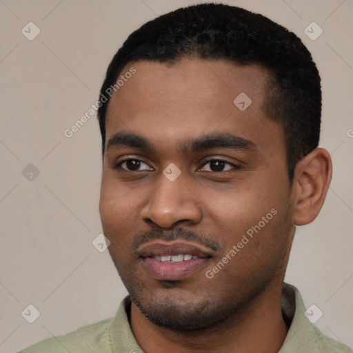 Joyful black young-adult male with short  black hair and brown eyes