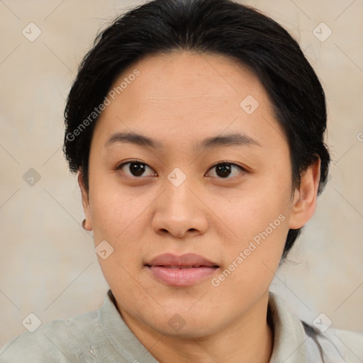 Joyful asian young-adult female with medium  brown hair and brown eyes