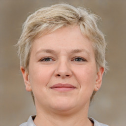 Joyful white adult female with short  brown hair and grey eyes