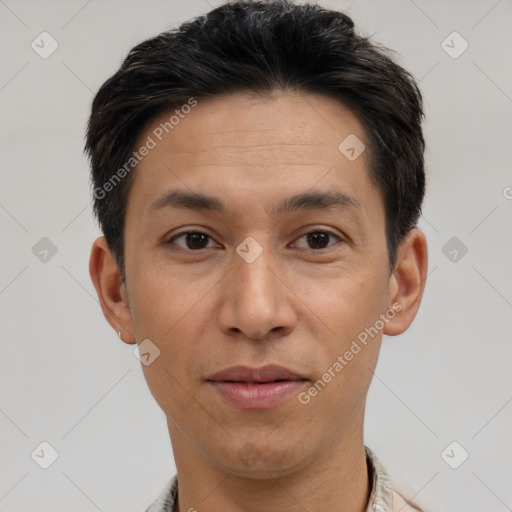 Joyful white adult male with short  black hair and brown eyes