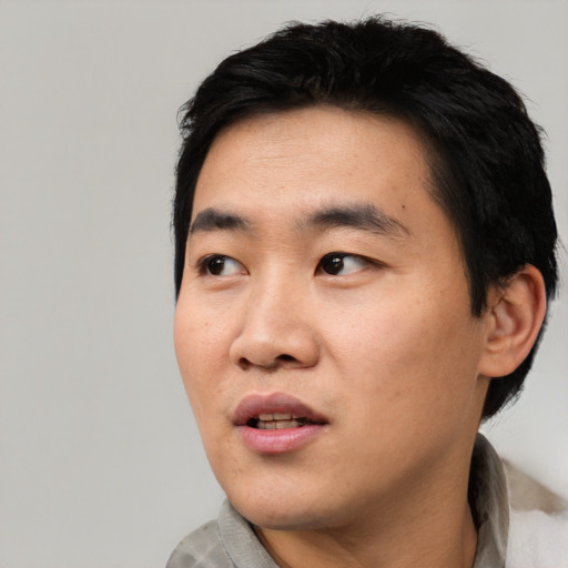 Neutral asian young-adult male with short  black hair and brown eyes
