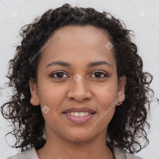 Joyful black young-adult female with medium  brown hair and brown eyes