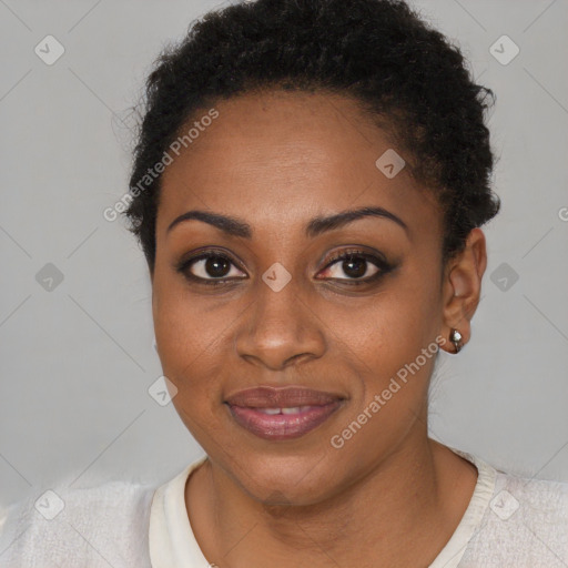 Joyful black young-adult female with short  brown hair and brown eyes