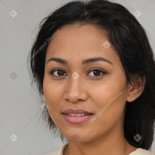 Joyful latino young-adult female with medium  brown hair and brown eyes