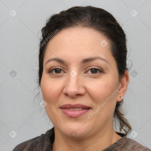 Joyful white adult female with medium  brown hair and brown eyes