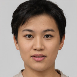 Joyful asian young-adult female with short  black hair and brown eyes