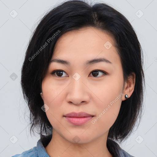 Joyful asian young-adult female with medium  black hair and brown eyes