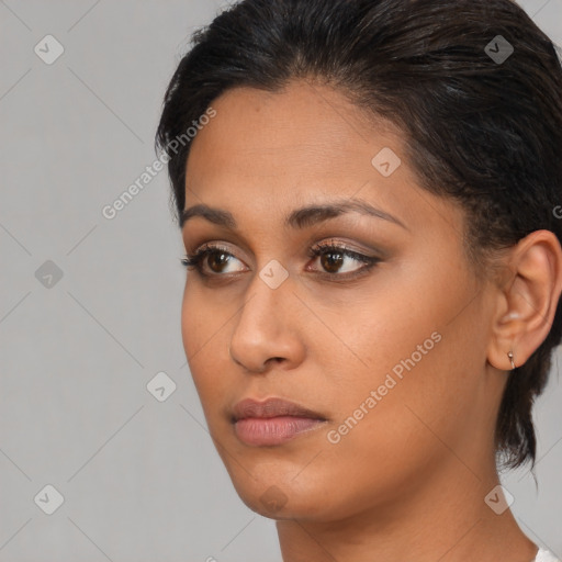 Neutral white young-adult female with medium  brown hair and brown eyes