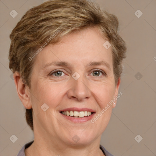 Joyful white adult female with short  brown hair and grey eyes