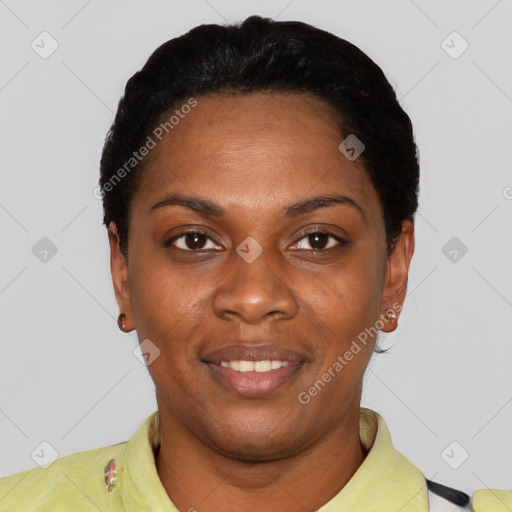 Joyful black young-adult female with short  black hair and brown eyes