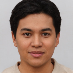 Joyful asian young-adult male with short  brown hair and brown eyes