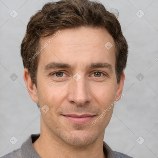 Joyful white adult male with short  brown hair and grey eyes