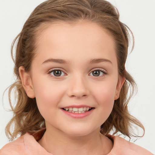 Joyful white child female with medium  brown hair and brown eyes