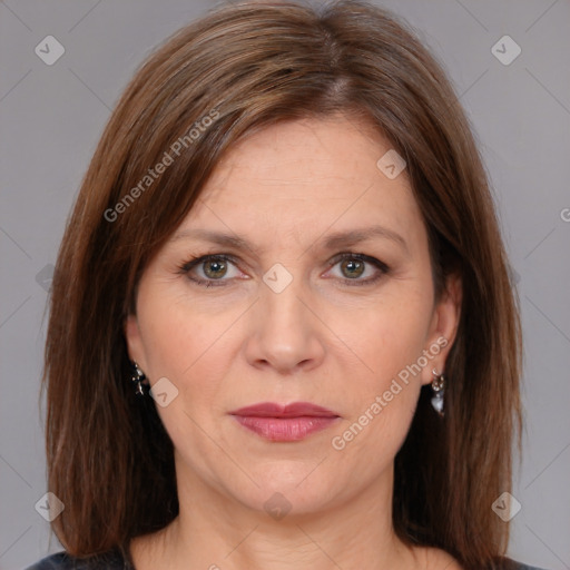 Joyful white adult female with medium  brown hair and brown eyes