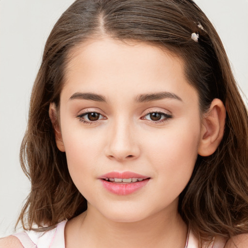 Joyful white child female with long  brown hair and brown eyes