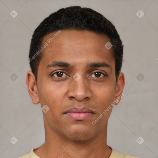 Joyful black young-adult male with short  black hair and brown eyes