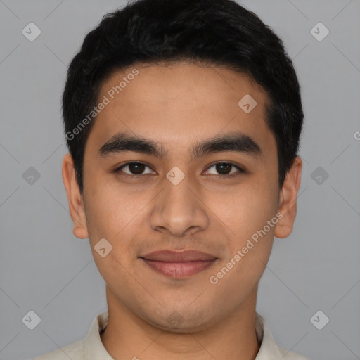 Joyful latino young-adult male with short  black hair and brown eyes