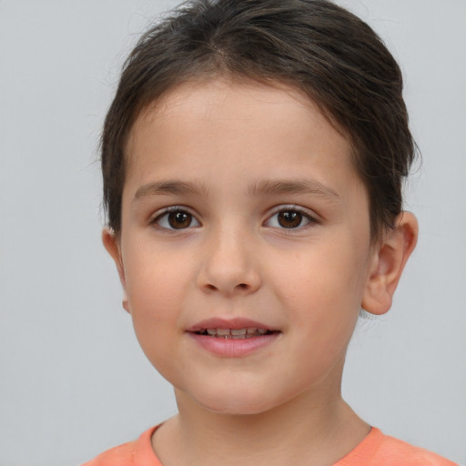 Joyful white child female with short  brown hair and brown eyes