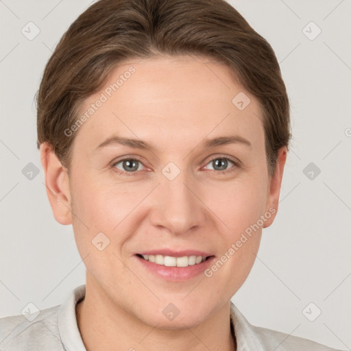 Joyful white young-adult female with short  brown hair and grey eyes