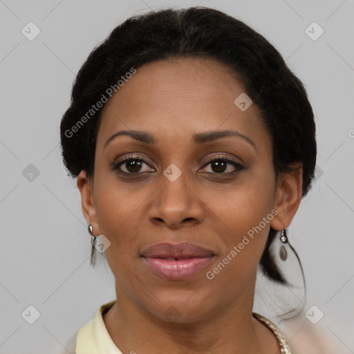 Joyful black adult female with short  brown hair and brown eyes