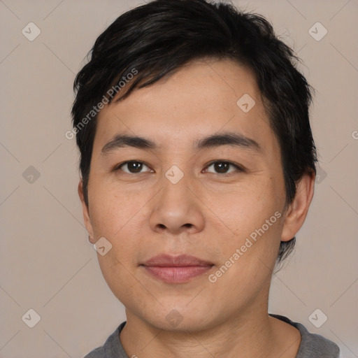 Joyful asian young-adult male with short  black hair and brown eyes