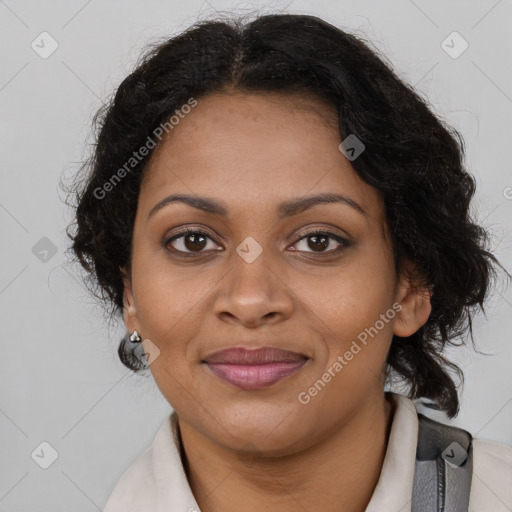 Joyful black adult female with long  brown hair and brown eyes