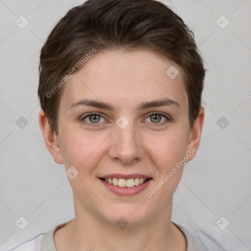 Joyful white young-adult female with short  brown hair and grey eyes